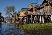 Inle Lake Myanmar. All the buildings are constructed on piles. Residents travel around by canoe, but there are also bamboo walkways and bridges over the canals, monasteries and stupas. 